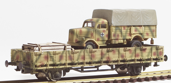 REI Models 460311SAC - German WWII Opel Blitz  in Ambush Camo loaded on a heavy 4 axle DRB flat car